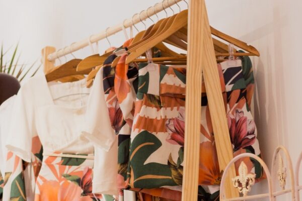 photo of clothes hanging on a clothing rack