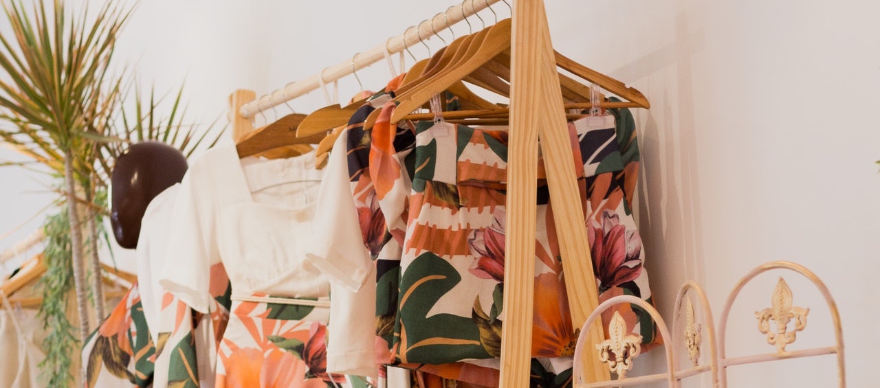photo of clothes hanging on a clothing rack