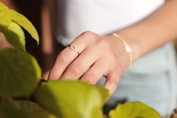 photo of an arm with minimalistic ethical jewellery
