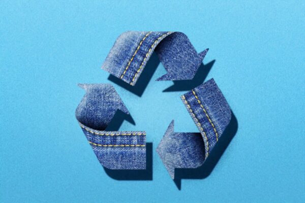 recycle logo made up of denim scraps
